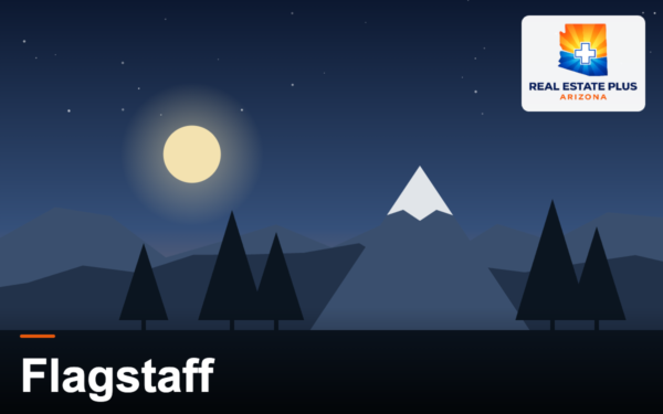 Flagstaff pines and snowy peak at dusk — Real Estate Plus Arizona