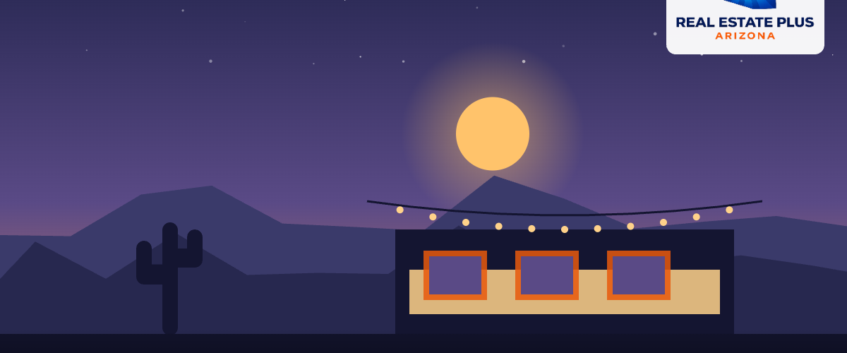 Art gallery windows under string lights — Real Estate Plus Arizona
